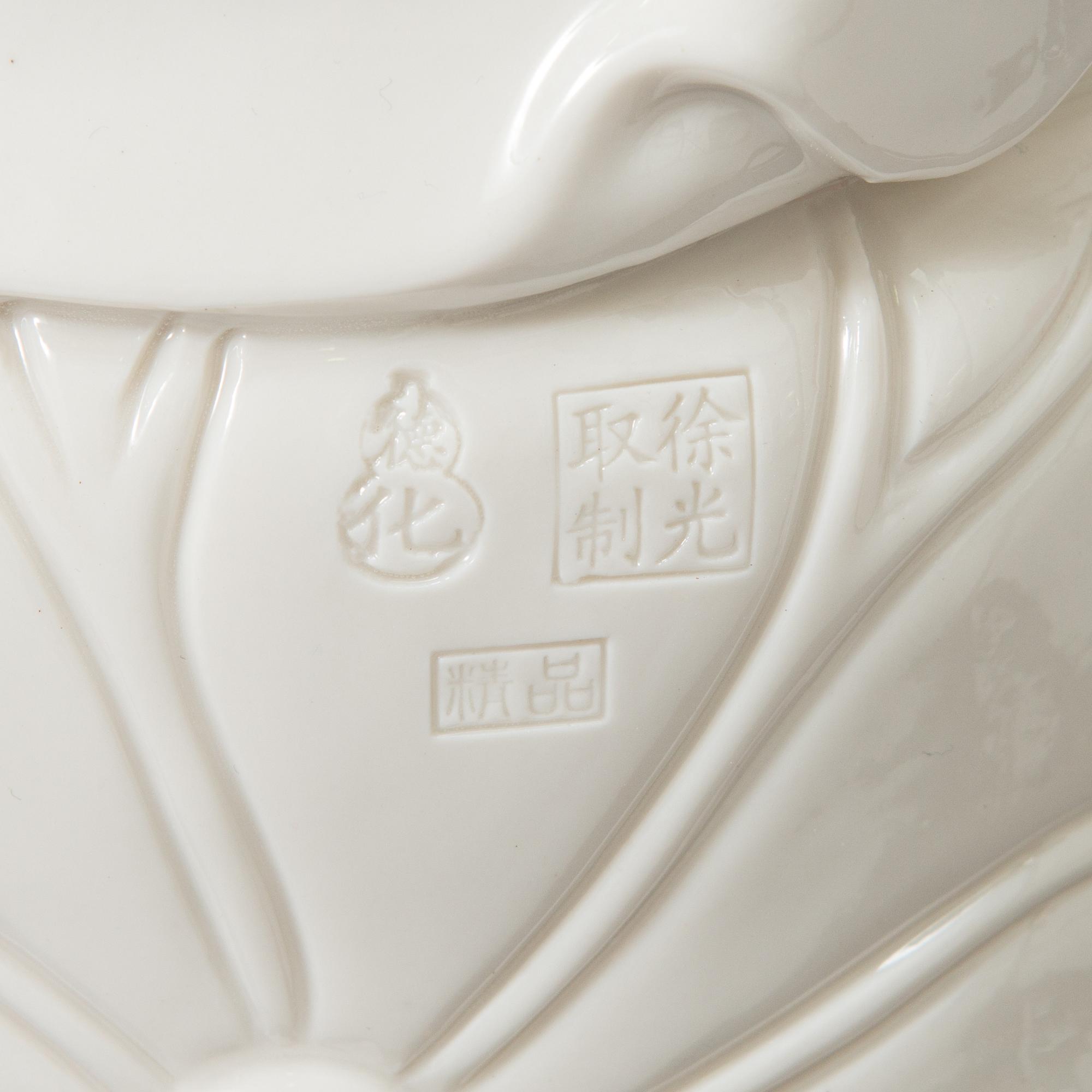 An oriental Buddha statue in porcelain.