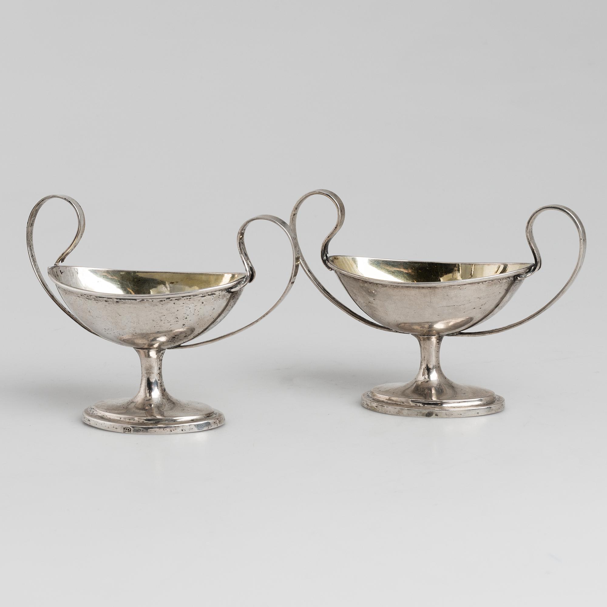 A pair of firt half of the 19th century parcel-gilt silver salt-cellars by an uknown master, one marked HB.