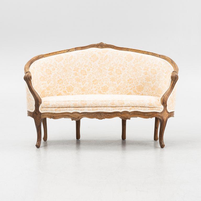 A mahogany Louis XV sofa, France, 18th Century.