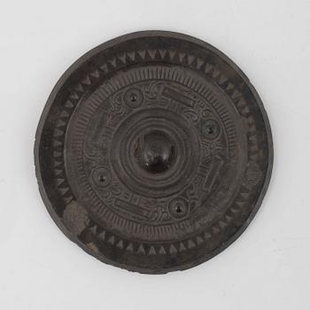 Four bronze lobed mirrors,  Han dynasty (206 B.C.-220 A.D.).