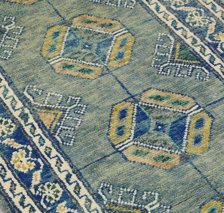 An Oriental runner, c. 393 x 79 cm.
