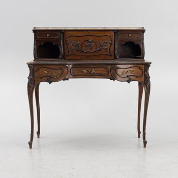 A mahogany veneered desk, mid 20th Century.