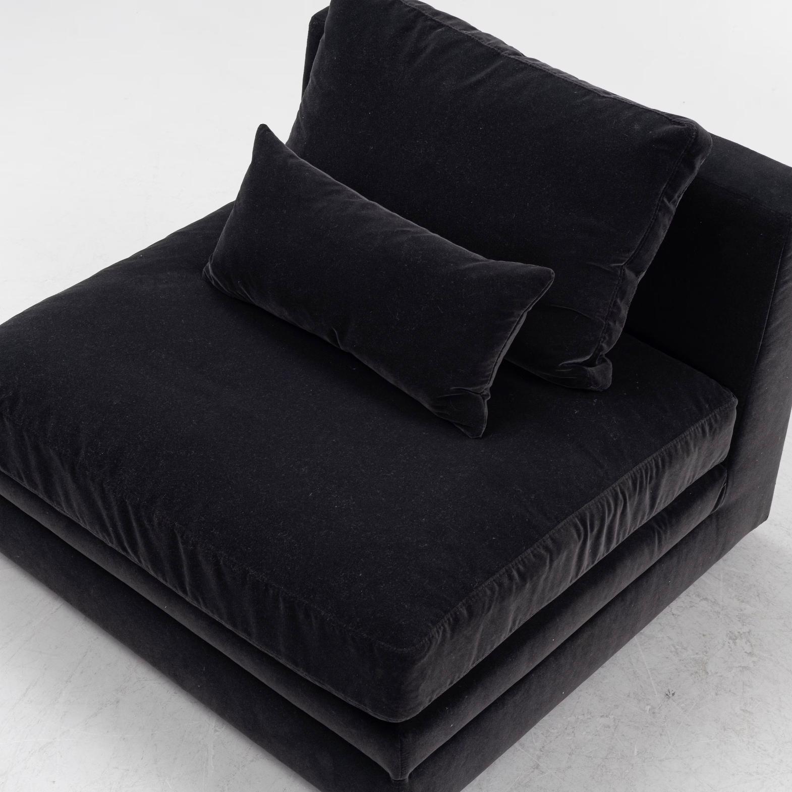 Two 21st century lounge chairs.