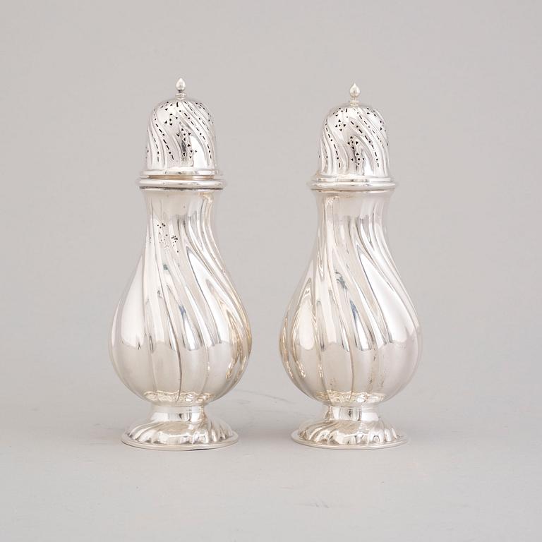 A pair of early 20th cenury silver sugar dispensers.