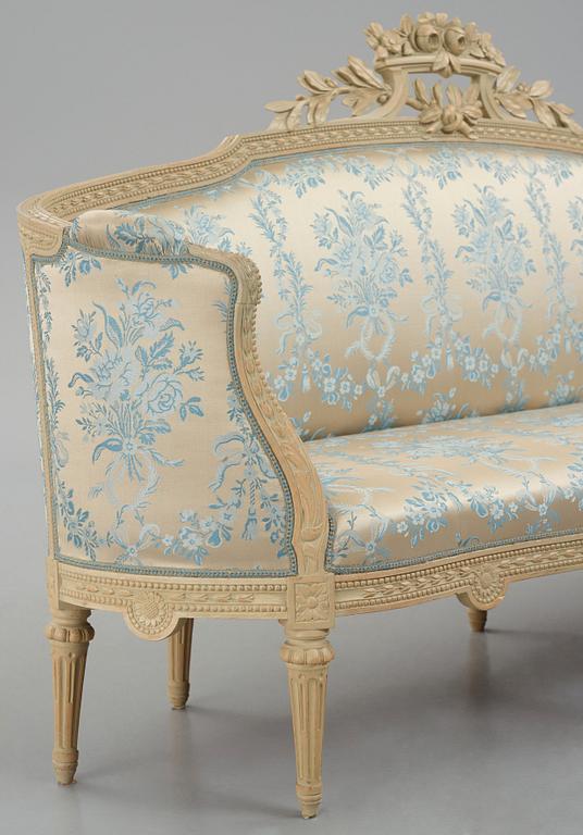 A grey-painted Gustavian 'canapé en corbeille'. sofa, later part of the 18th century.