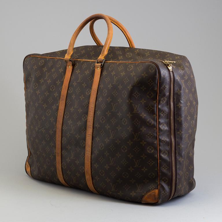 LOUIS VUITTON, a mongram canvas suitcase.