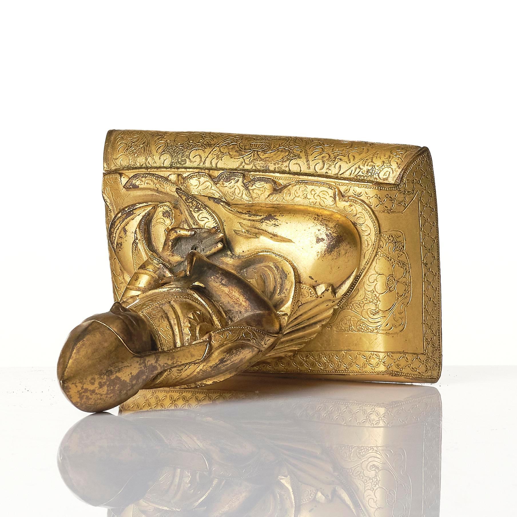 A gilt bronze figure of a Lama, Tibeto-Chinese, 18th/19th century.