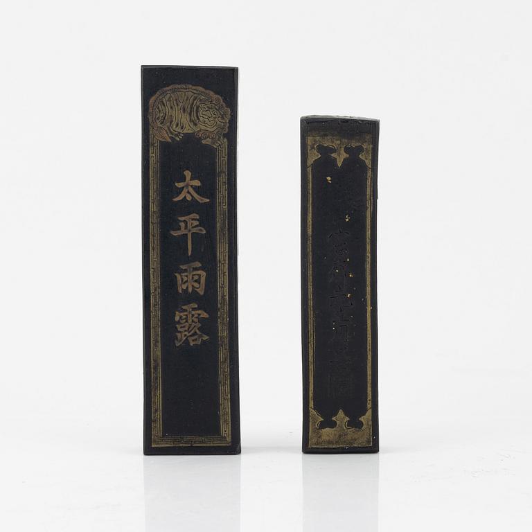 A set of four stone scholars objects and a enameled silver box with cover, Qing dynasty, circa 1900.