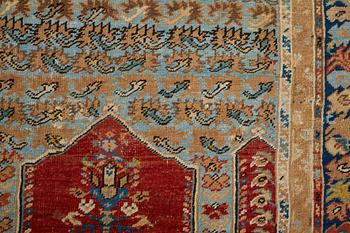 A RUG, an antique Anatolia, probably Gördes, a prayer rug, ca 177 x 124,5 cm (as well as flat weave at the ends 3 and 1.