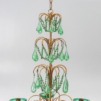 A chandelier, likely from Italy, circa 1950.
