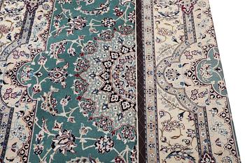 A Nain carpet, part silk, 6 laa, c. 300 x 201 cm.