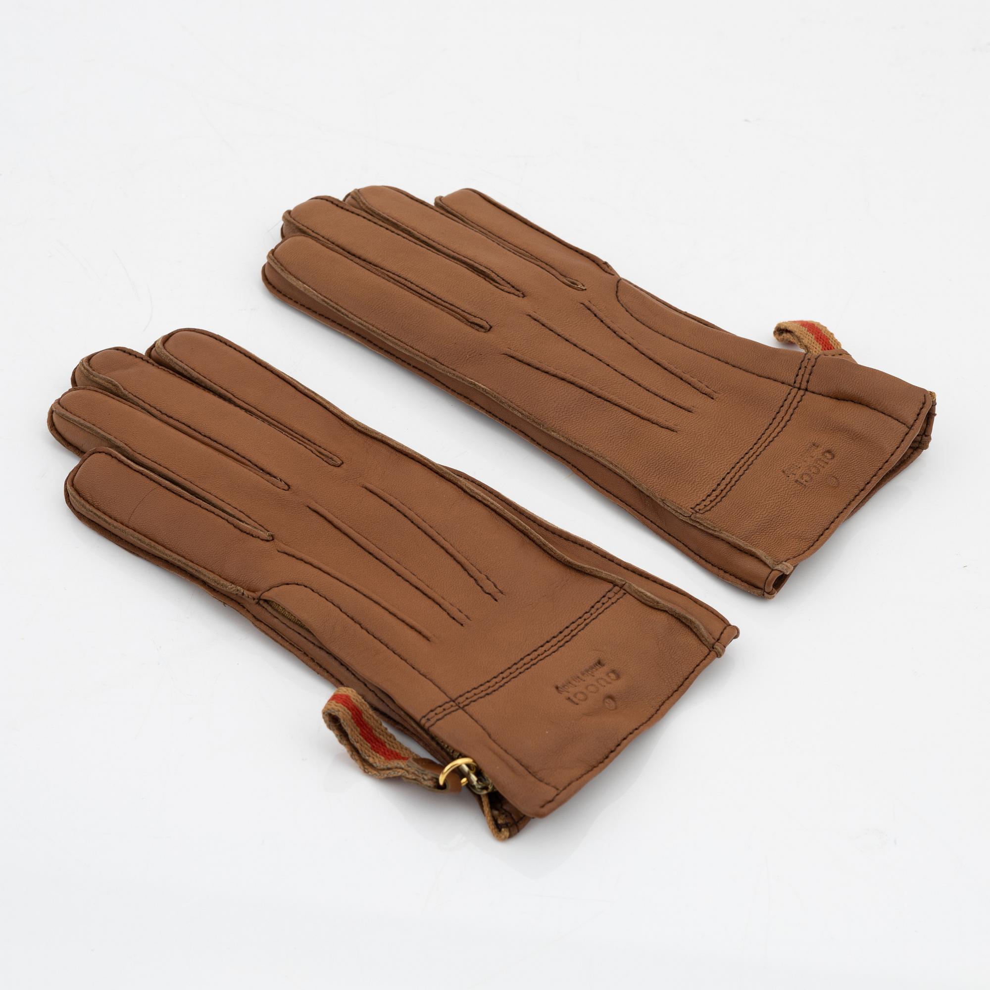 Gucci, a pair of tan leather gloves, size 6 1/2.