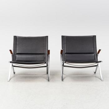 A pair of  'X-chairs' by Preben Fabricius & Jørgen Kastholm, designed 1968.