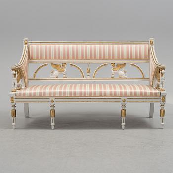 A set of two armchairs, a sofa, a stool and a chair. Early 20th century.