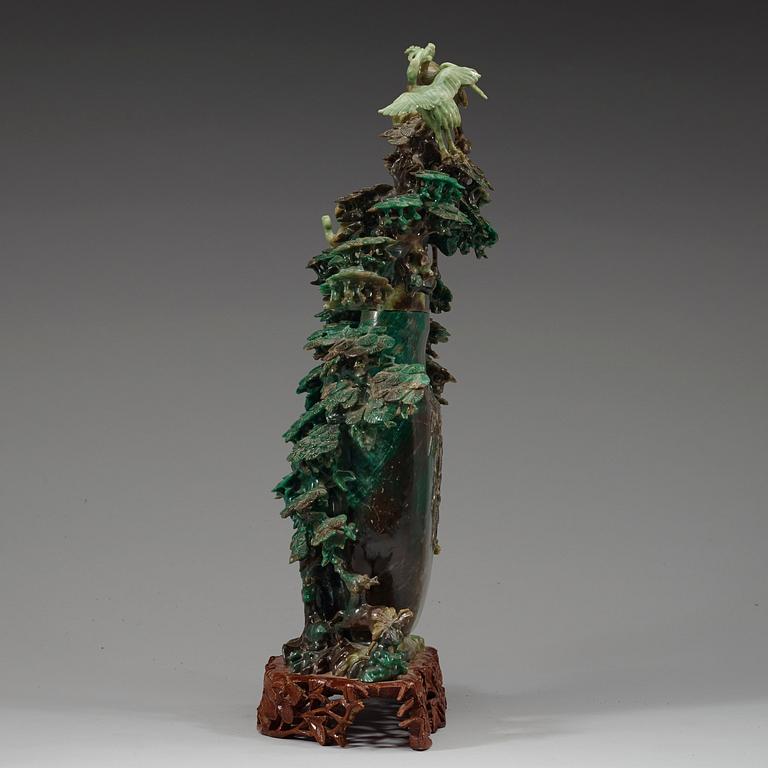 A large, Chinese carved jade pine tree with birds, 20th Century.