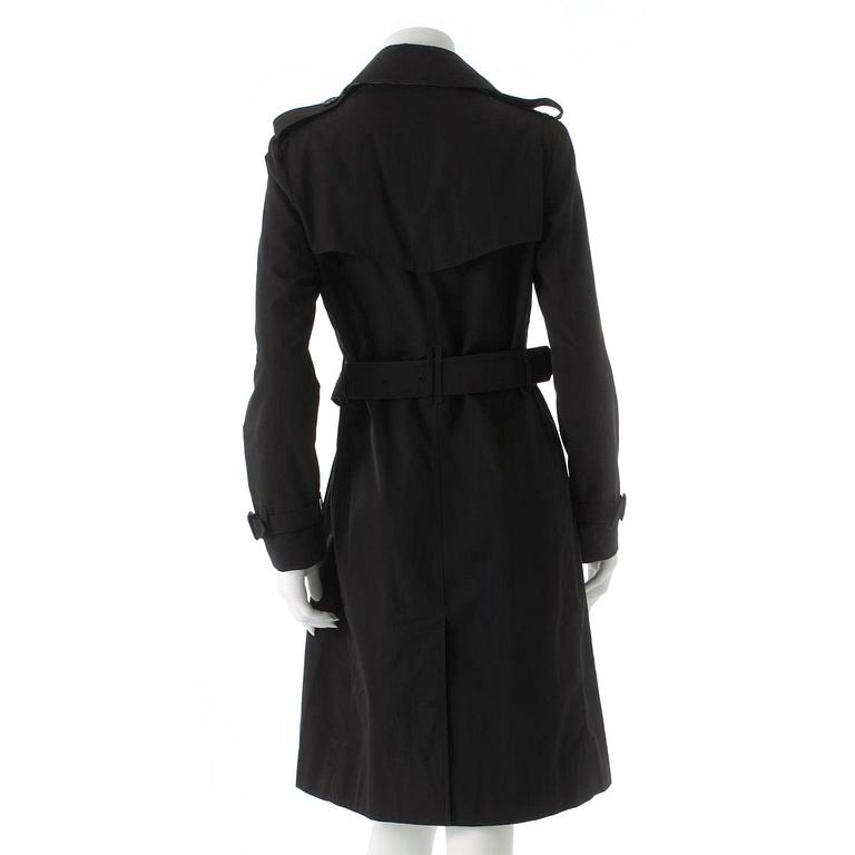 BURBERRY, a black cotton trench coat.