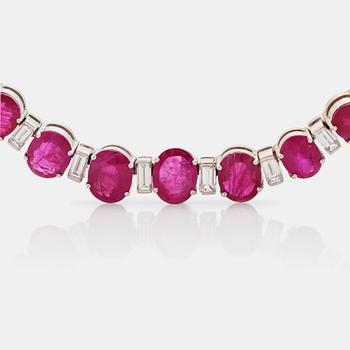 A ruby and baguette cut diamond rivière necklace by Demner New York. Total carat weight of diamonds circa 9.00 cts.
