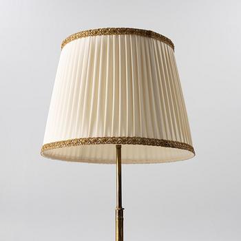 A brass floor lamp, 1940s.