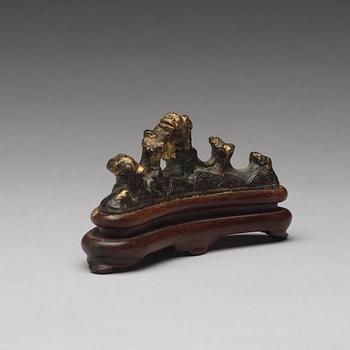 A bronze brush rest, Ming dynasty (1368-1644).