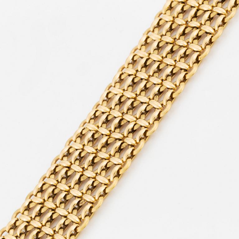 A Cartier 18K gold bracelet.