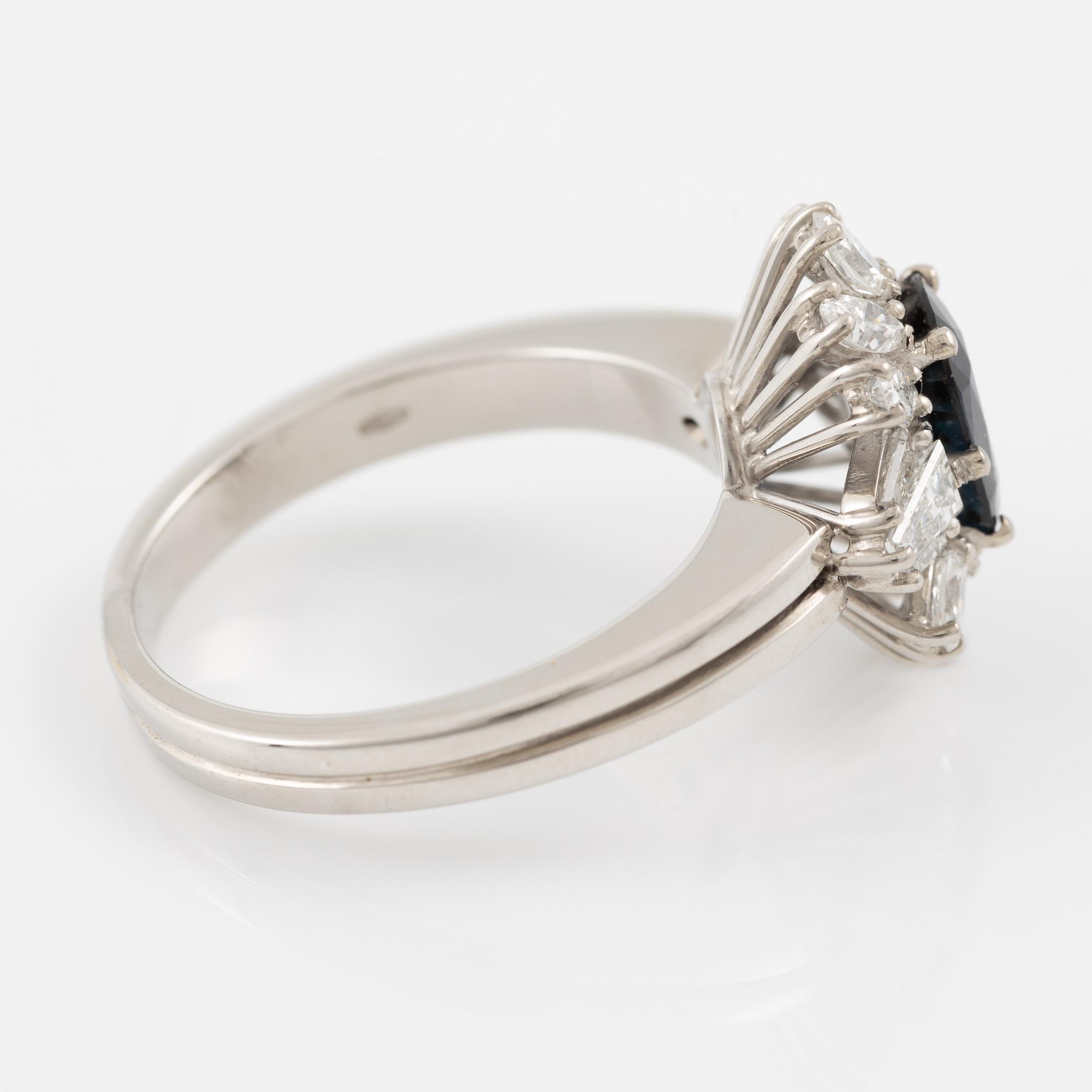 Ring, 18K white gold with sapphire and trapeze- and navette-cut diamonds.