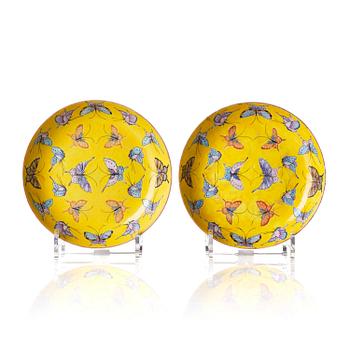 1045. A pair of yellow ground 'butterfly' dishes, late Qing dynasty with Tongzhi mark in red.