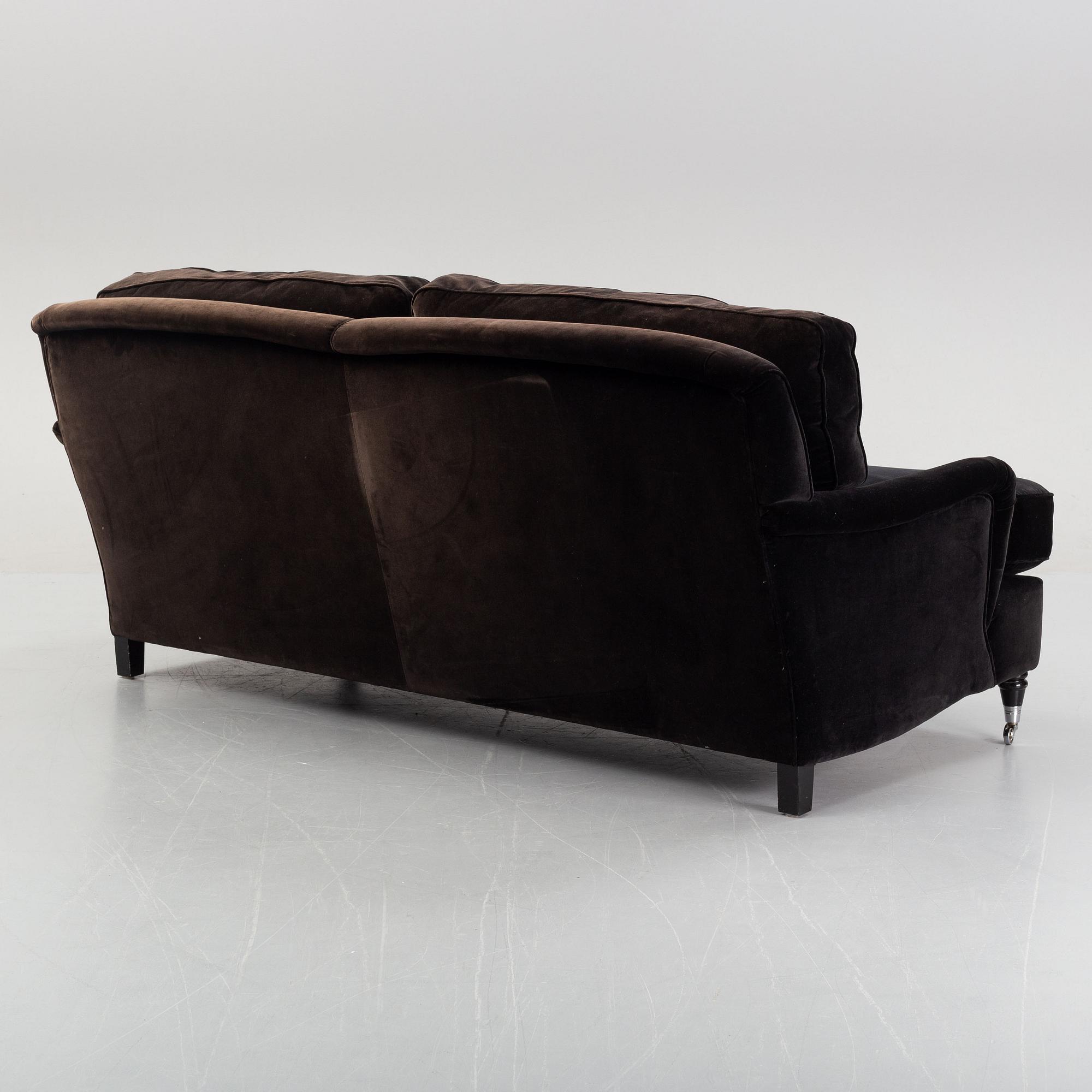 A contemporary velvet Howard sofa.