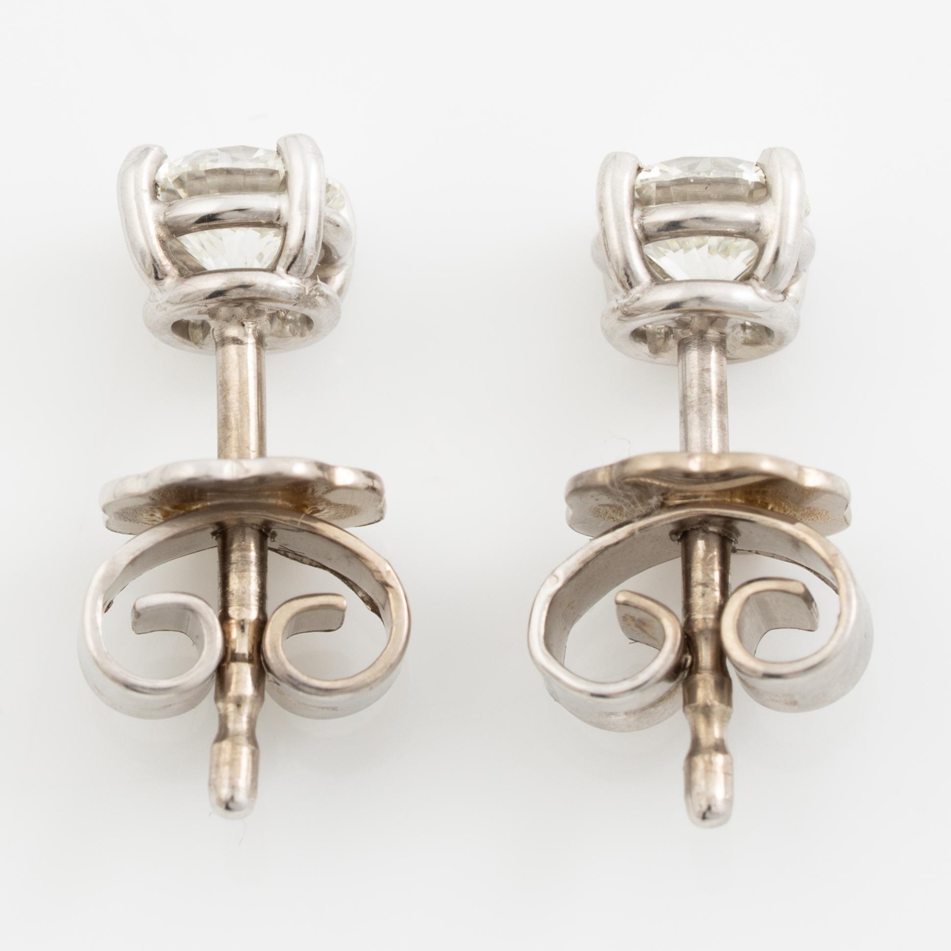 Earrings, a pair, 18K white gold with brilliant-cut diamonds totalling 0.60 ct.