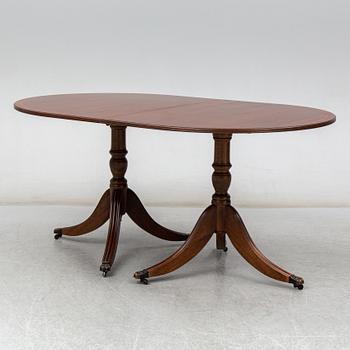 A late 20th century English dining table. One leaf included.