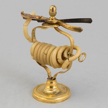 An early 19th century gilt brass candle / candle cutter.