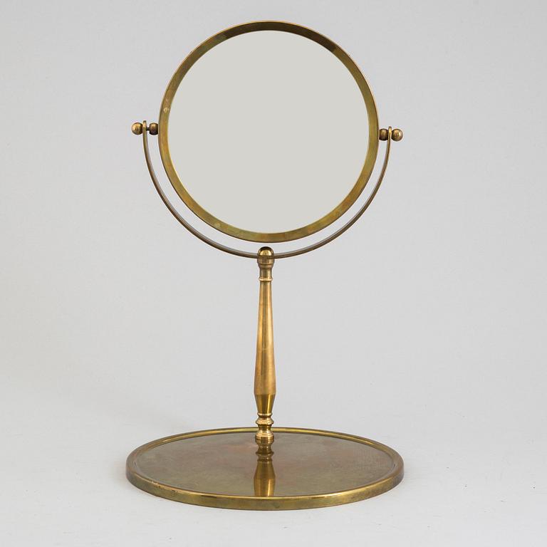 A mid 20th century brass and glass mirror.