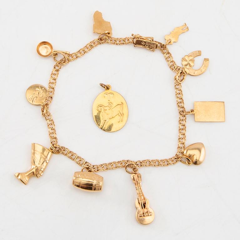 Armband Bismarck-länk 18K guld med berlocker.