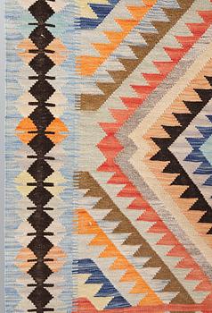 A kilim carpet, ca 386 x 151 cm.
