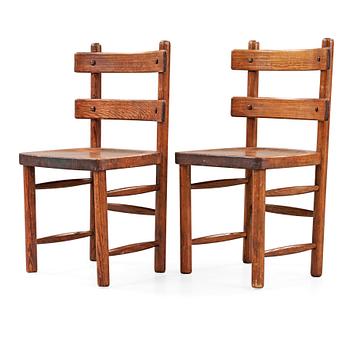 A pair of Axel Einar Hjorth stained pine 'Sandhamn' chairs.