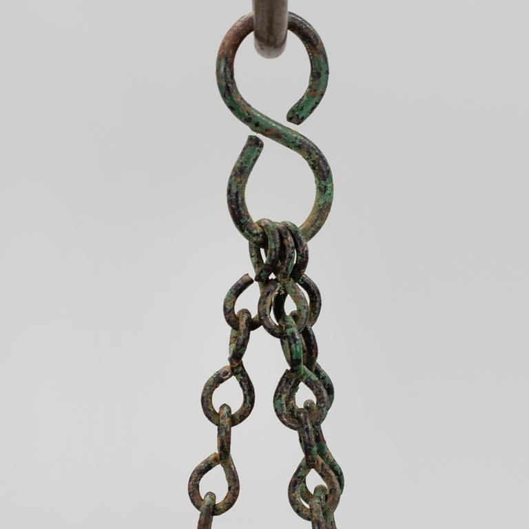 A CAST IRON  HANGING FLOWER POT, first half of the 20th century.