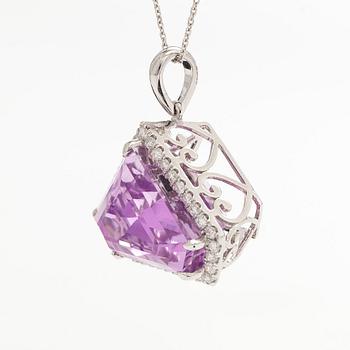 A 14K gold necklace with kunzite and brilliant cut diamonds.