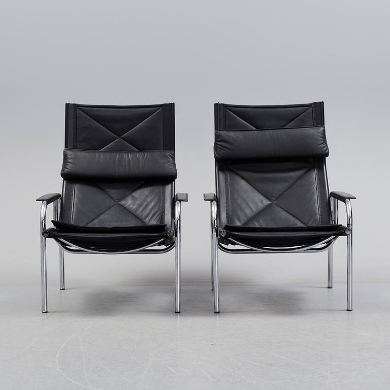 A pair of easy chairs and ottoman, designed by Hans Eichenberger, Strässle, Switzerland.