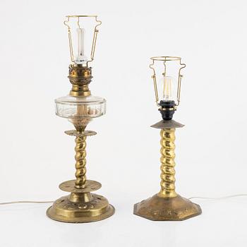 Two Baroque style brass table lamps from around the year 1900.