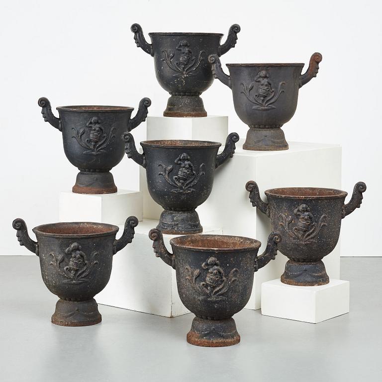 Ivar Johnsson, a set of seven "Faun" black painted cast iron jardinières, Näfveqvarn, Sweden.