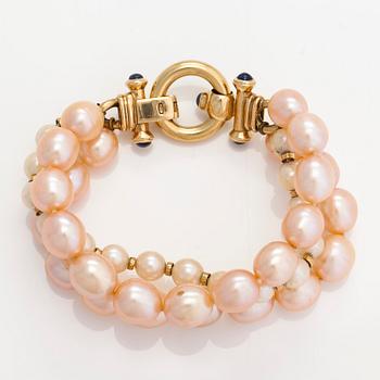 A cultured saltwater and freshwater pearl bracelet, 18K gold and cabochon-cut sapphires. Finnish import hallmarks.