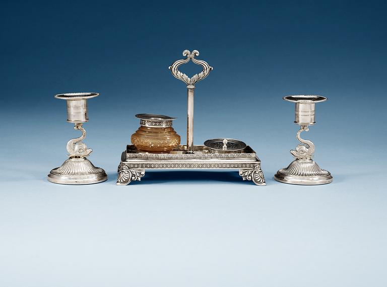 A SWEDISH SILVER WRIGHTING-STAND AND A PAIR OF CANDLESTICKS, Makers mark of Gustaf Möllenborg, Stockholm 1830 and Adolf Zethelius, Stockholm 1812. Provenance: Fredrika Bremer.