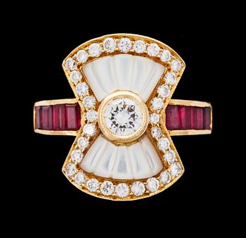 A diamond, ruby and mother of pearl ring.