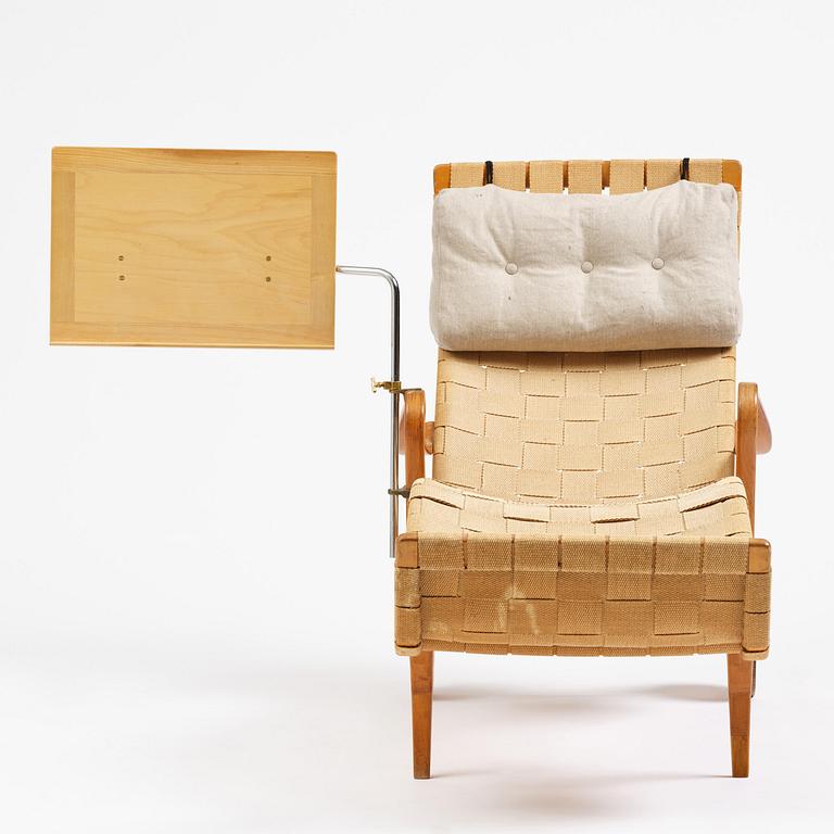 Bruno Mathsson, a lounge chair with wheels, Firma Karl Mathsson, Värnamo, 1940s, with reading table from 1972.