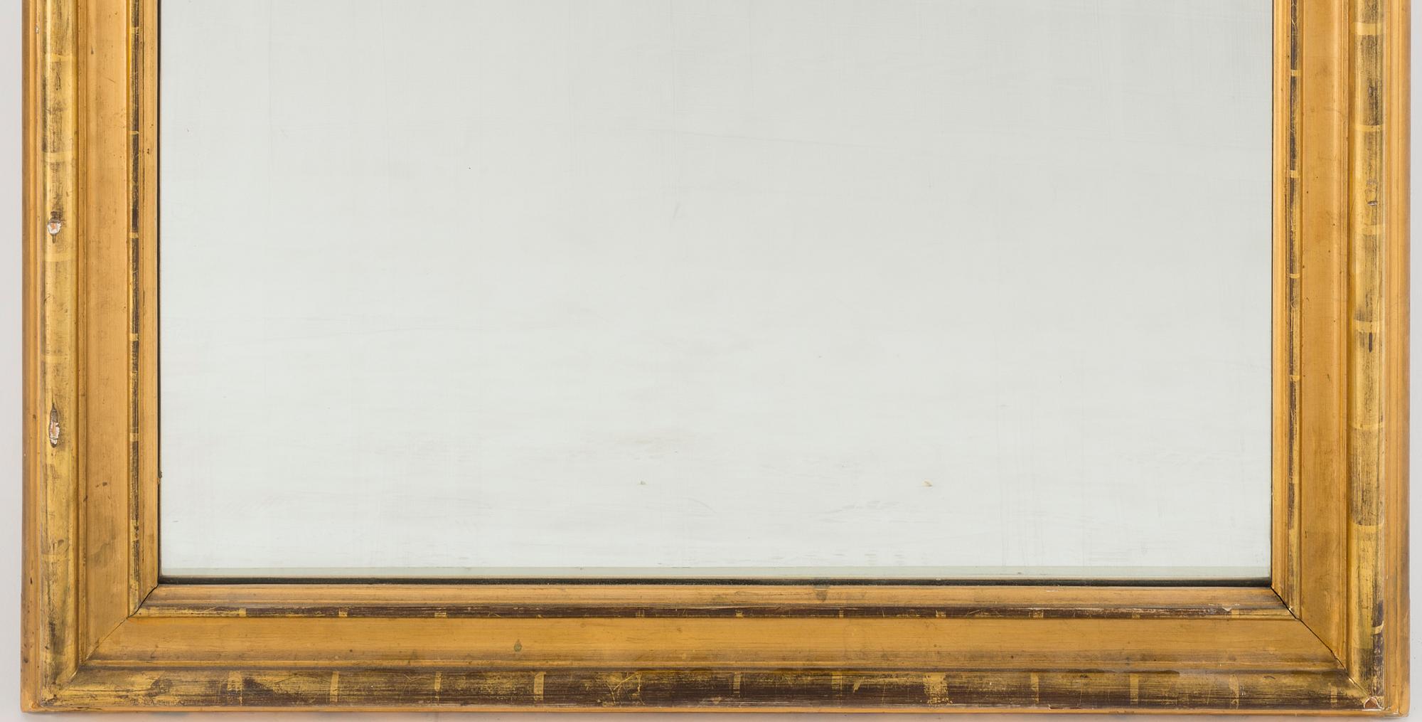 A gilt wood mirror and marble top console table, early 20th Century.