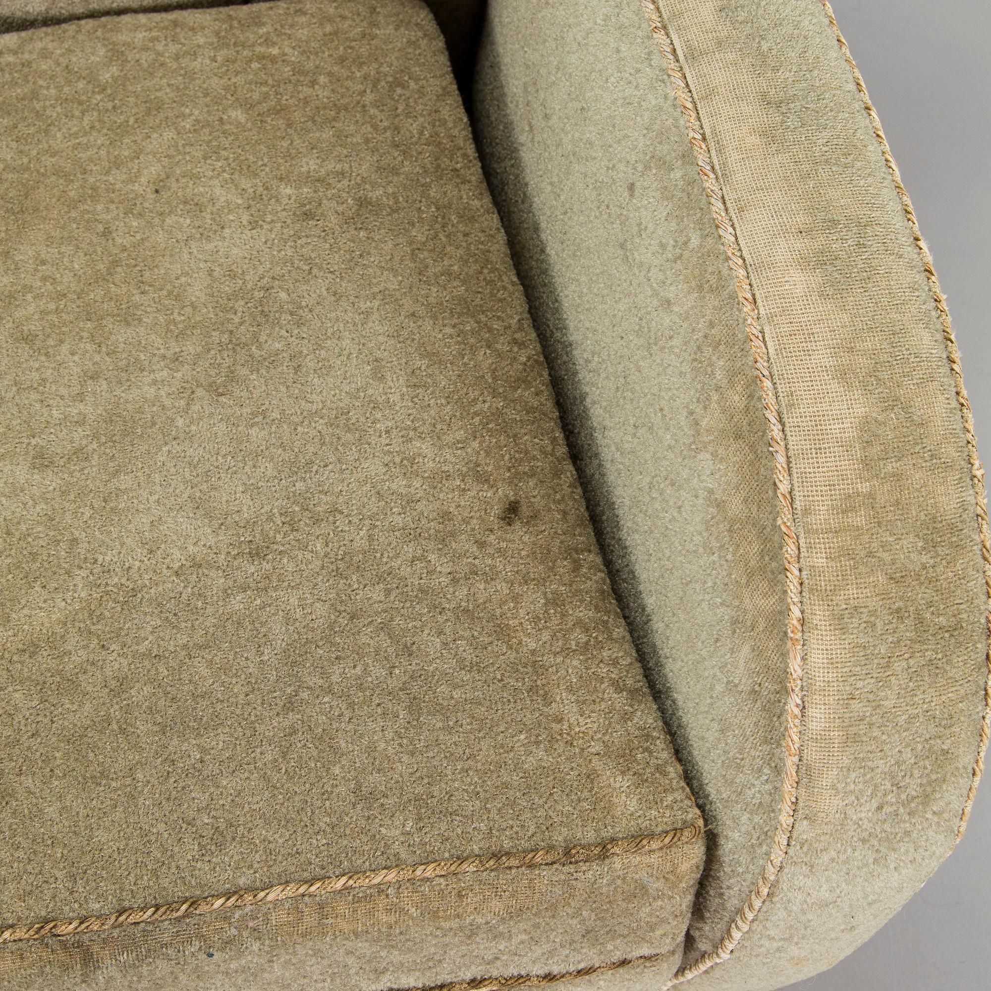 A pair of mid-20th century armchairs.