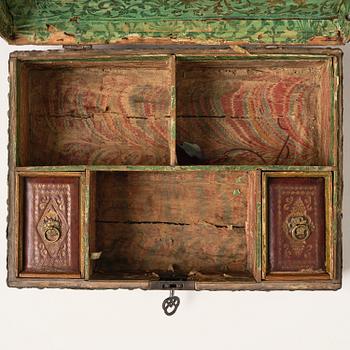 A presumably German baroque repoussé brass writing box, late 17th century.