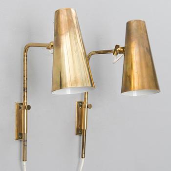 A pair of mid-20th century wall lights for Idman, Finland.