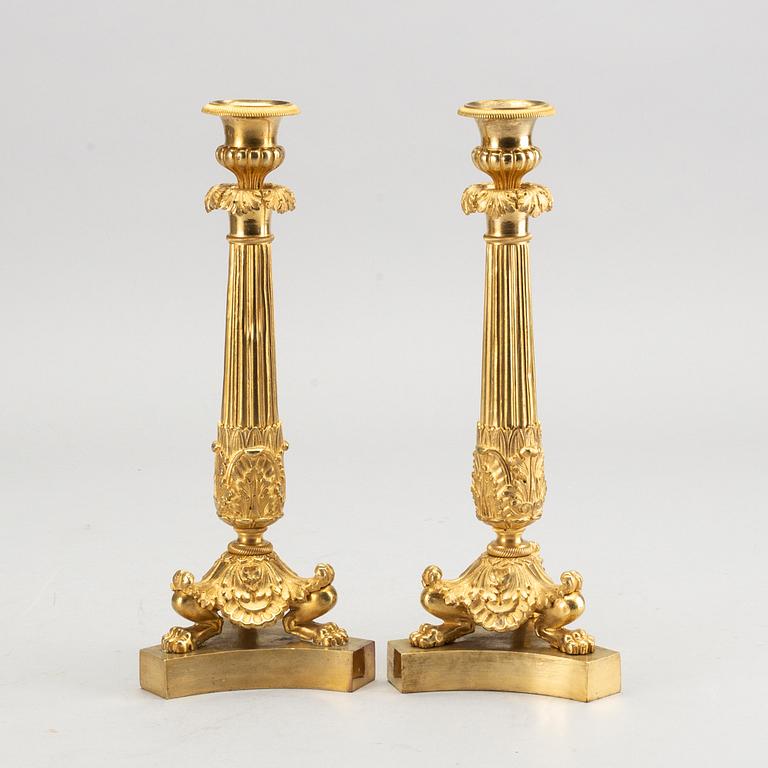 A pare of late empire candelsticks mid 19th century.