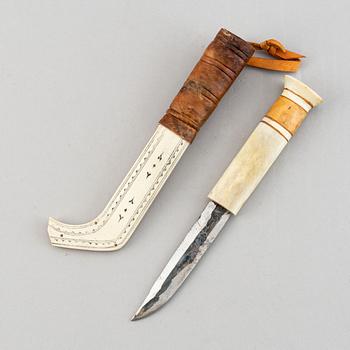 Erik Tuolja, two Sami reindeer horn, birch wood, fur and leather knives, one signed ET.