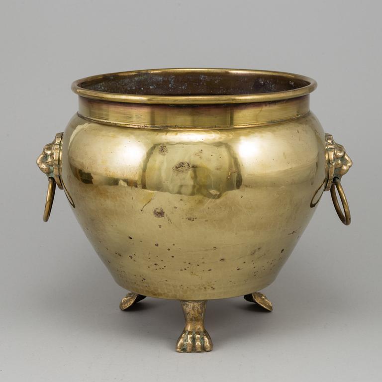 A 19th century brass champagne cooler.